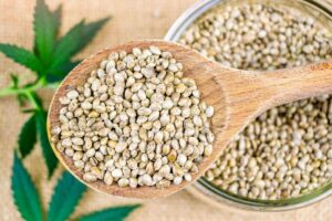 cannabis-seeds-in-wooden-spoon-on-hemp-cloth-and-h-QLEYL94-scaled